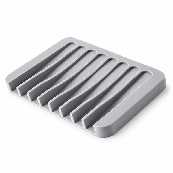 Saboneteira de silicone autodrenante com base antiderrapante para a pia, vista frontal em fundo branco