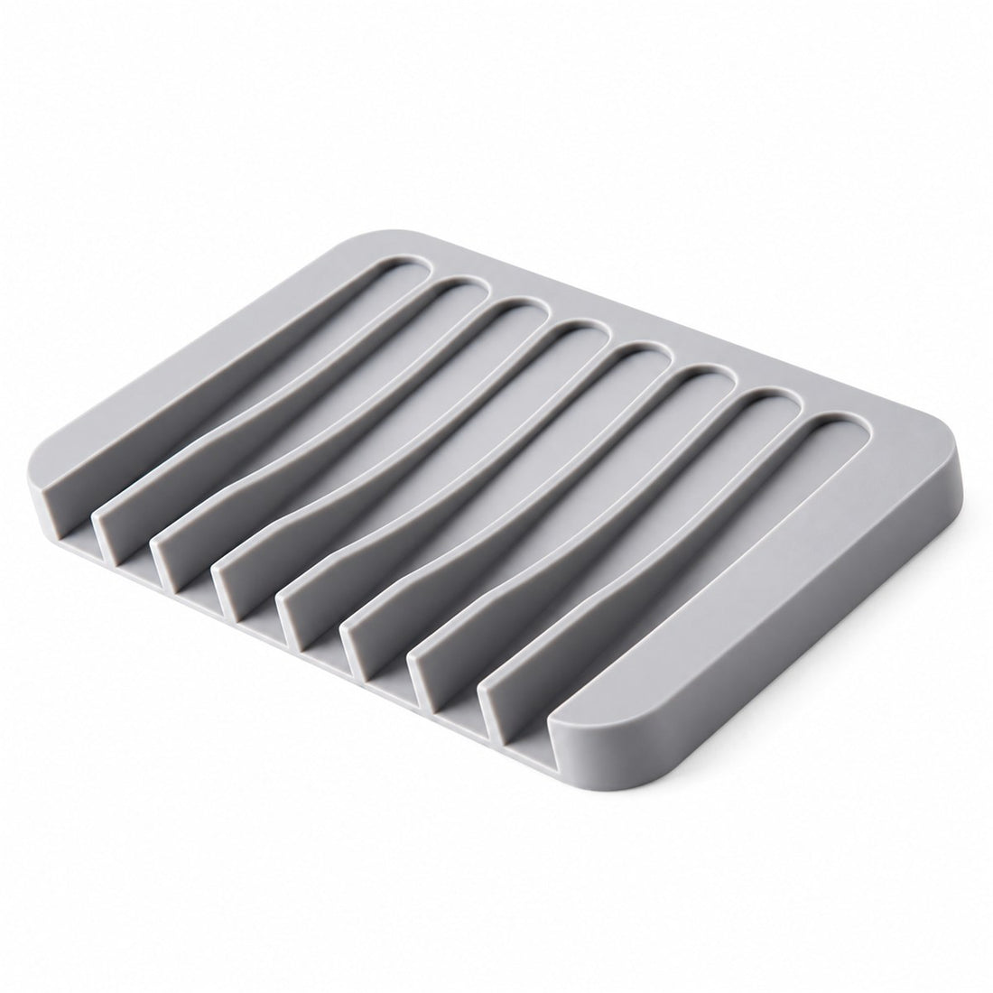 Saboneteira de silicone autodrenante com base antiderrapante para a pia, vista em ângulo 3/4