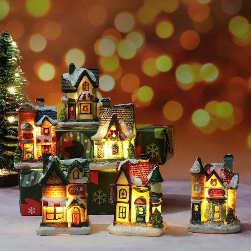Casinha de Natal iluminada por dentro sobre o peitoril da janela