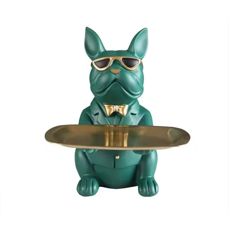 Escultura de cachorro com bandeja guardando chaves sobre o aparador