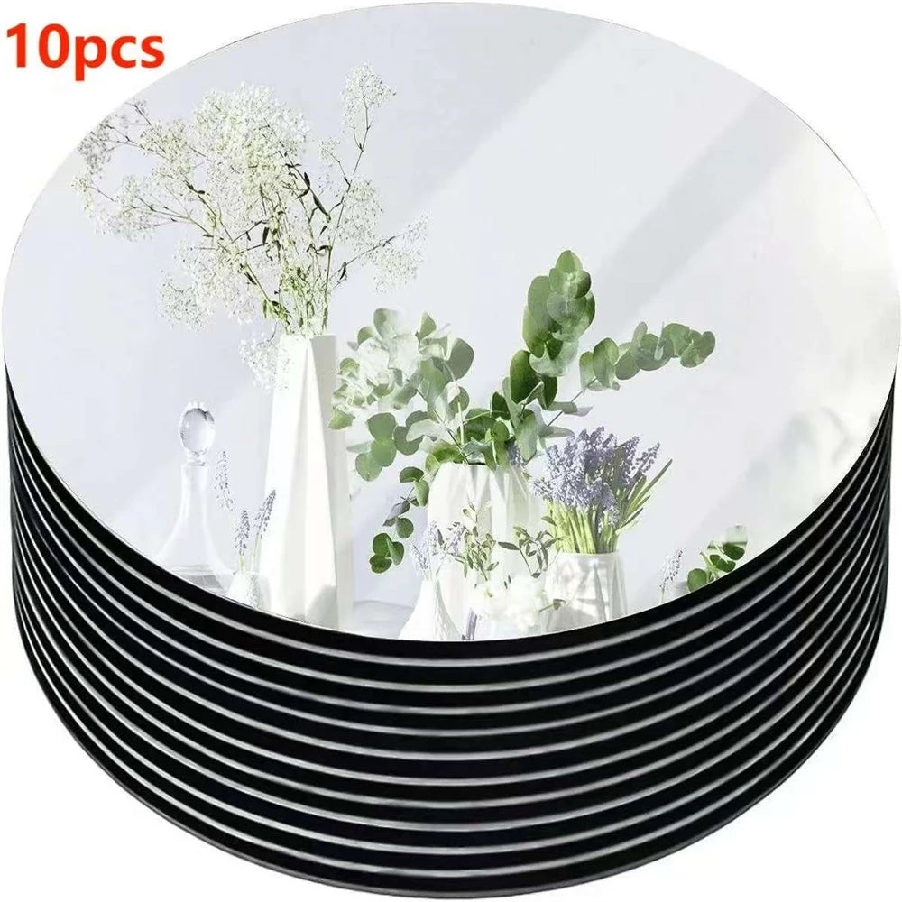 Dez discos espelhados redondos de 20 cm usados como base para velas na mesa