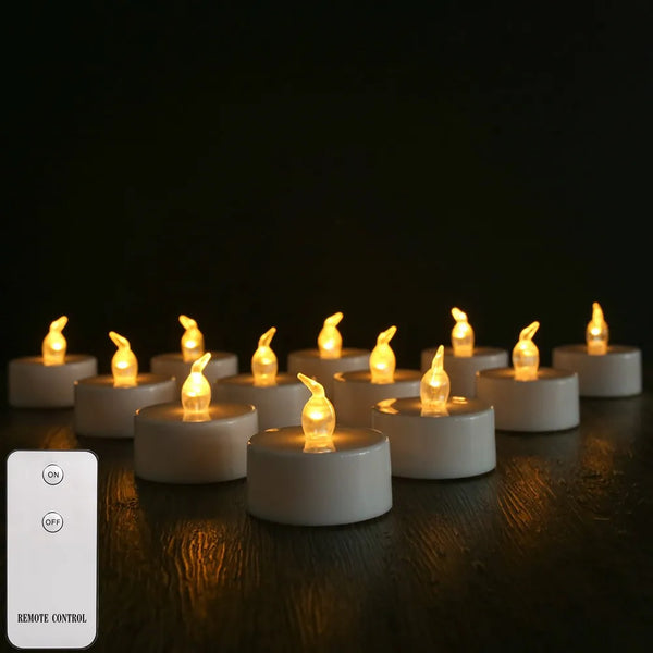 Doze velas de LED acesas sobre a mesa com o controle remoto ao lado