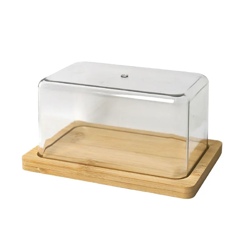 Manteigueira de bambu com tampa de acrílico transparente sobre a mesa posta
